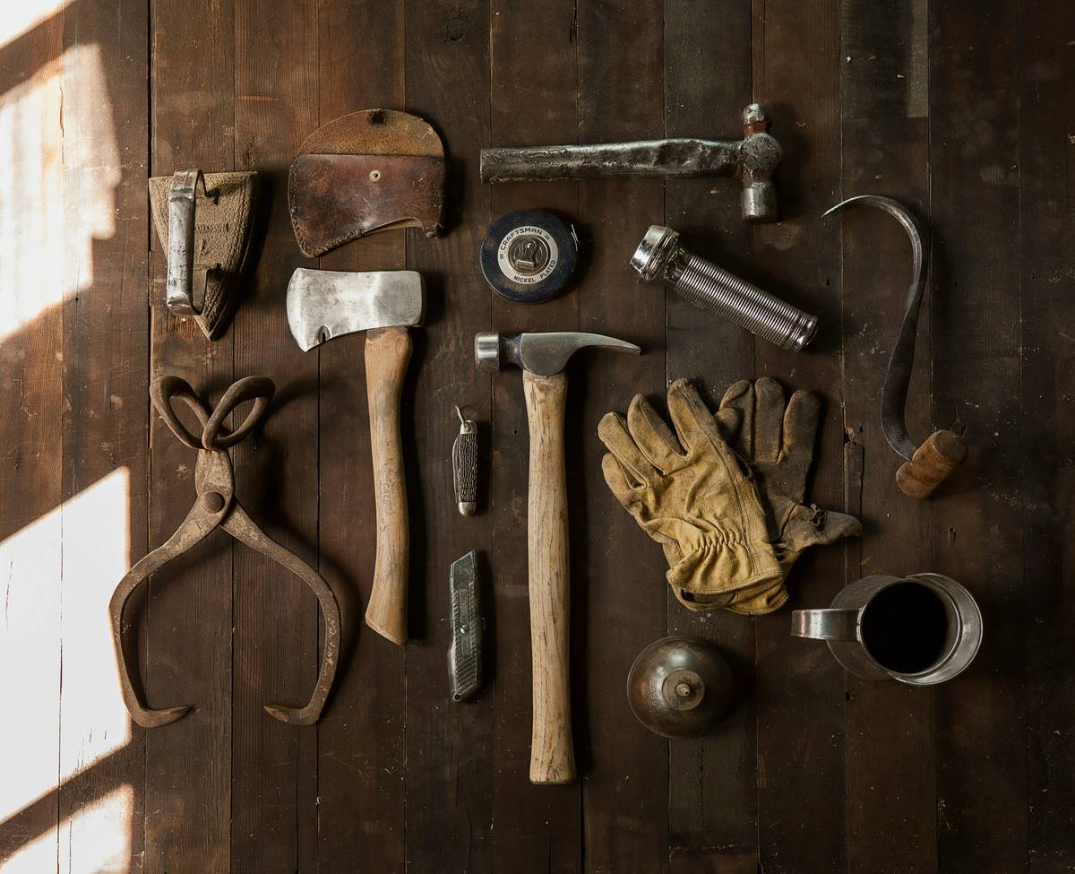 wright tools wrenches set laid flat on a concrete garage floor beside a cracked bolt and measuring calipers